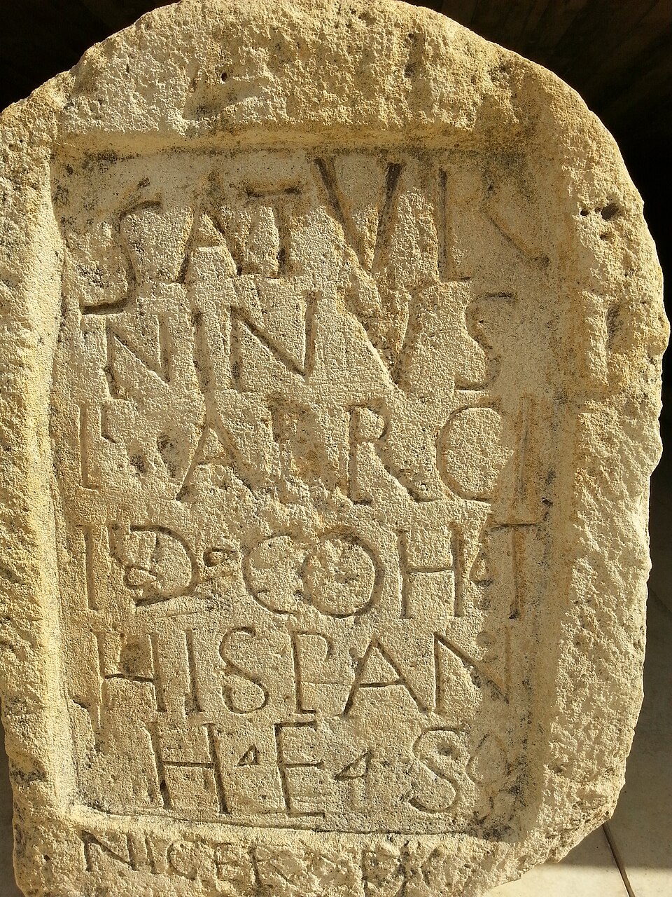 A Roman limestone block carved with a Latin dedication, from Volubilis in Morocco